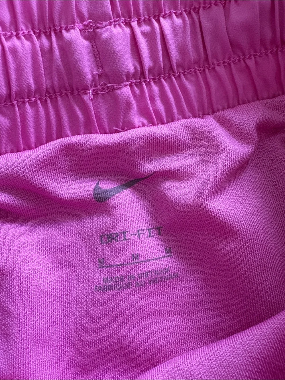 Nike Girl’s Pink Athletic Shorts with White Swoosh